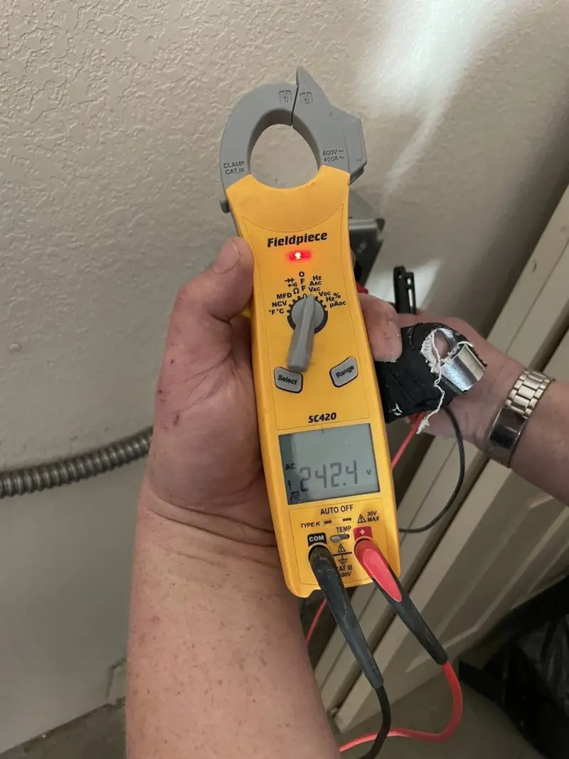 Voltage testing with clamp meter during Aluminum Wiring Replacement in Rush